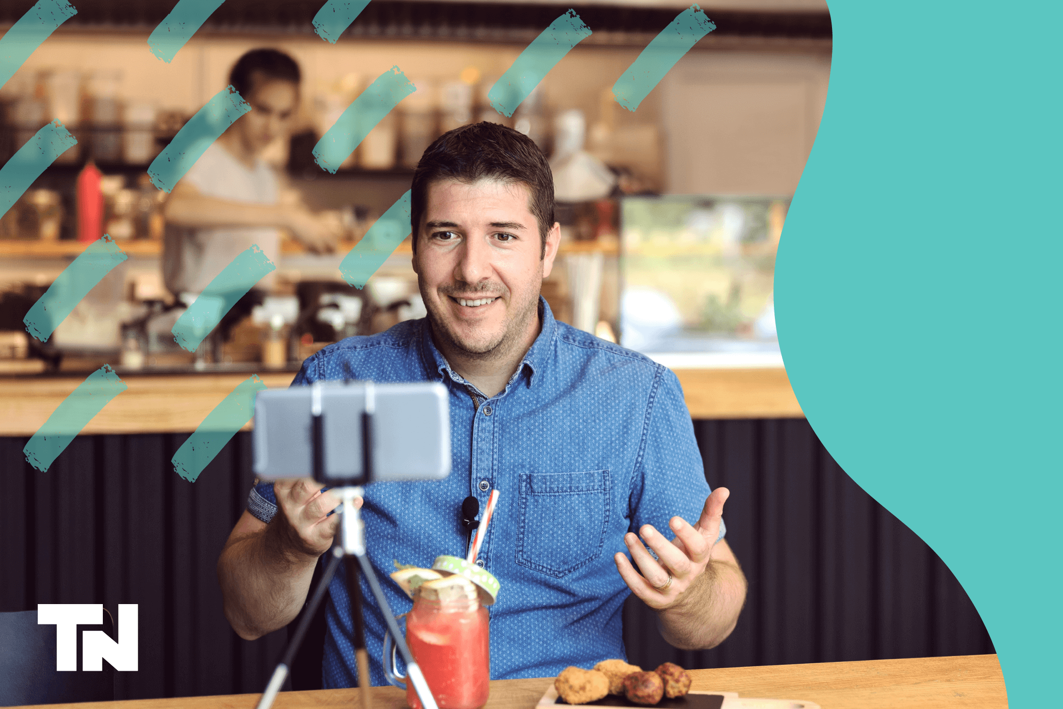 Young male restaurant owner recording a video for social media