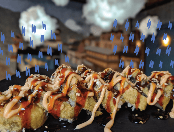 Close up of sushi rolls covered with a delicious sauce