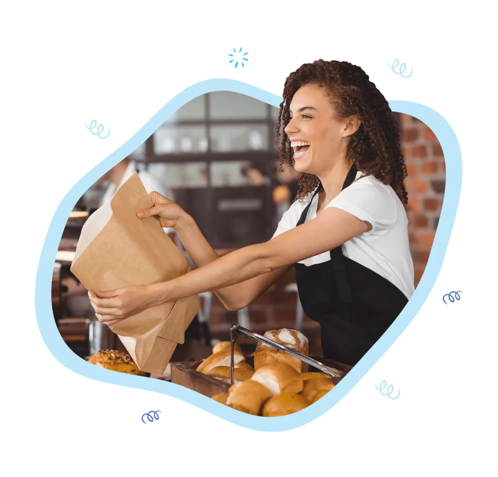 Captivating image of a joyful young woman handing a bag of delectable pastries with a warm smile. Experience the speed and efficiency of our Quick Service Restaurant (QSR) Point of Sale system designed to delight guests and alleviate operational stress.